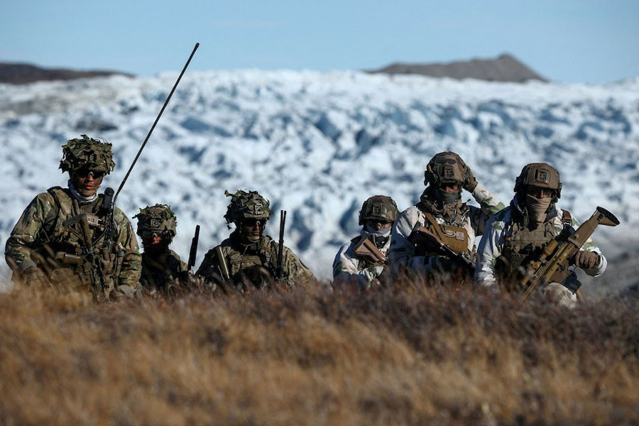 Members of the Danish armed forces practice looking for potential threats during a military drill as Danish, Swedish and Norwegian home guard units together with Danish, German and French troops take part in joint military drills in Kangerlussuaq, Greenland, September 17, 2025.