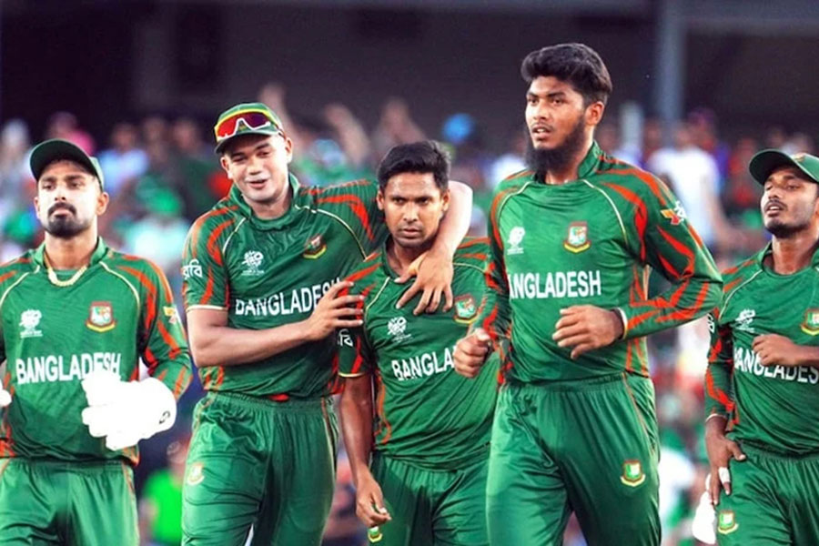 Bangladesh's ace pacer Mostafizur being greeted by fellow teammates as he takes a wicket in an international match. —BSS