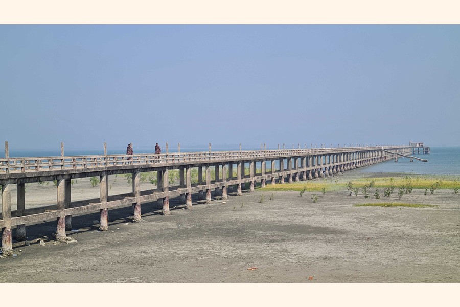 Two Border Guard Bangladesh personnel patrolling a bridge at Shah Porir Dwip as the ongoing armed conflict inside Myanmar has kept unsettled the Teknaf border area in Cox's Bazar district- FE Photo