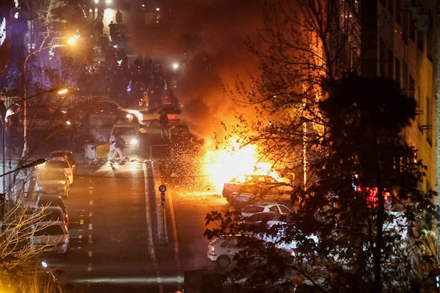 Cars burn in a street during a protest over the collapse of the currency's value, in Tehran, Iran on January 8, 2026 — Stringer/WANA (West Asia News Agency) via REUTERS