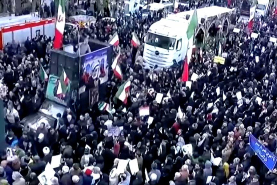People attend a funeral procession, held by the Iranian government, for those said to be killed in recent protests, in Tehran, Iran, in this still image taken from a video released on Jan14, 2026.