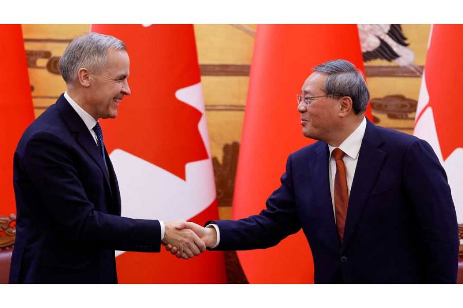 Canada’s Prime Minister Mark Carney shakes hands with China’s Premier Li Qiang at the end of the signing ceremony during the first visit by a Canadian prime minister to China since 2017, at the Great Hall of the People in Beijing, China Jan 15, 2026.