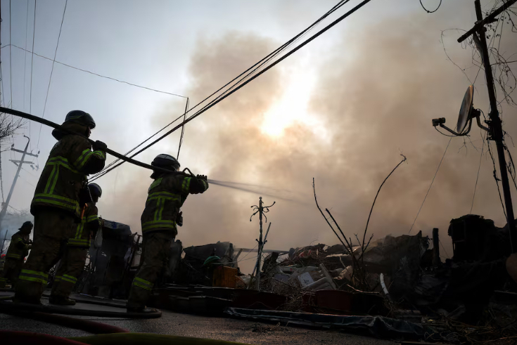 Firefighters work at the scene of a fire at Guryong village, the last shantytown in the Gangnam district, in Seoul, South Korea, January 16, 2026. REUTERS/Kim Hong-ji