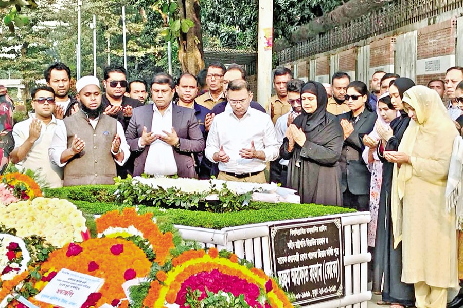 BNP Chairman Tarique Rahman, along with his family members, offers prayers at the grave of his brother Arafat Rahman Koko marking his 11th death anniversary at the Banani graveyard in the capital on Saturday. — Focus Bangla