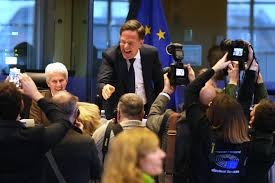 NATO Secretary General Mark Rutte, center, greets the audience prior to his address during the Security and Defence Committee at the European Parliament in Brussels, Monday, Jan. 26, 2026. (AP Photo/Virginia Mayo)
