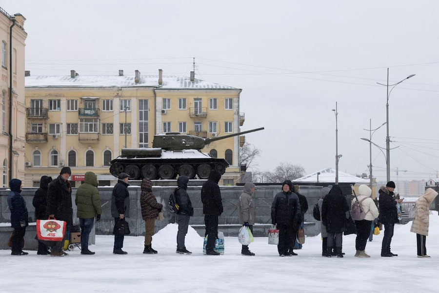 People line up at a bus stop during sub-zero temperatures, amid Russia's attack on Ukraine, in Kharkiv, Ukraine January 31, 2026.