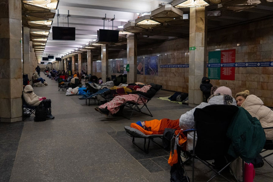 People take shelter in a metro station, being used as a bomb shelter, during a Russian drones attack in Kyiv, Ukraine, Tuesday, Feb. 3, 2026.