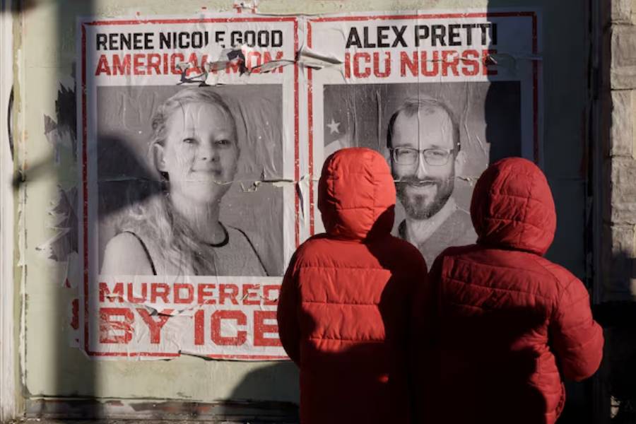 Children look at posters honoring Alex Pretti and Renee Nicole Good, who were fatally shot by federal immigration agents in separate incidents on January 24 and January 7, respectively, near the site of Pretti’s death, in Minneapolis, Minnesota, U.S., January 31, 2026.