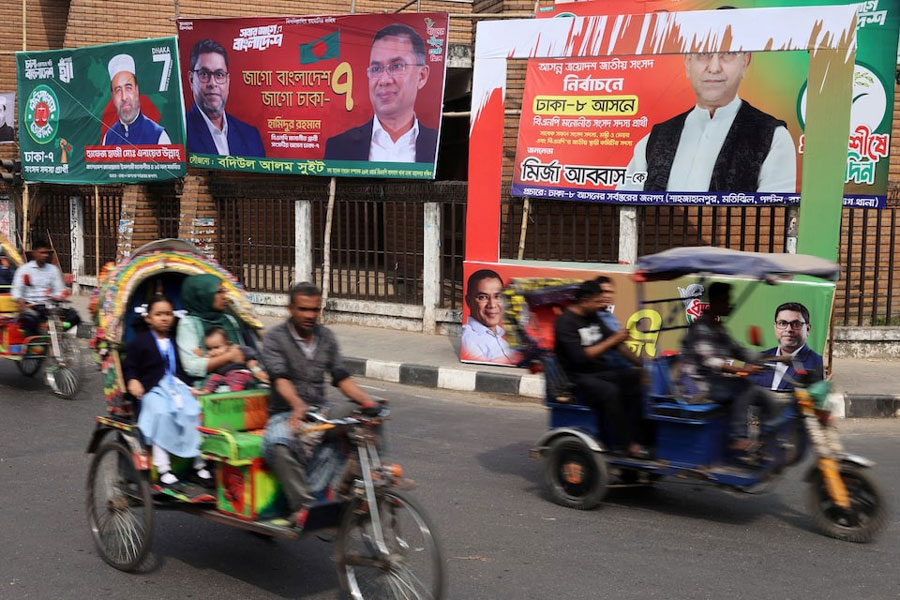 Vehicles pass by election campaign banners ahead of the national election, in Dhaka, Bangladesh, February 10, 2026.
