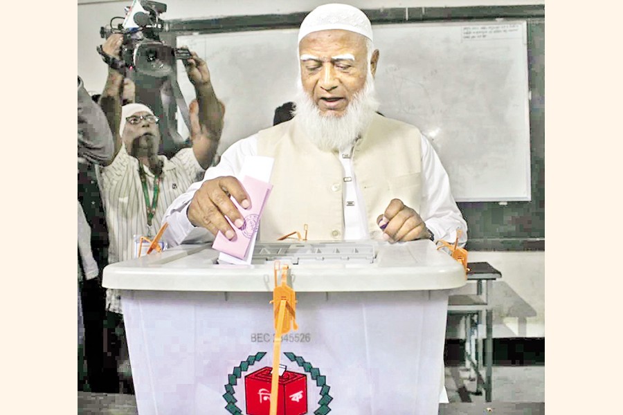 Jamaat-e-Islami Ameer Dr Shafiqur Rahman casts his vote at the Monipur High School and College centre in the capital's Mirpur Thursday — Focus Bangla photo