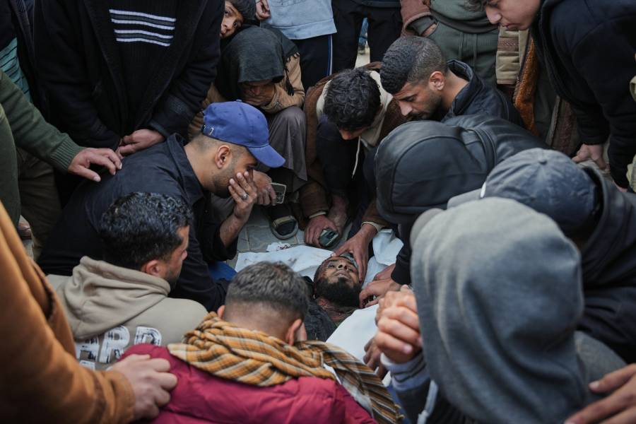 Palestinians mourn over the body of Hamas militant Firas al-Najjar, who was killed in an Israeli military strike, during his funeral at Nasser Hospital in Khan Younis, Gaza Sunday, Feb. 15, 2026.