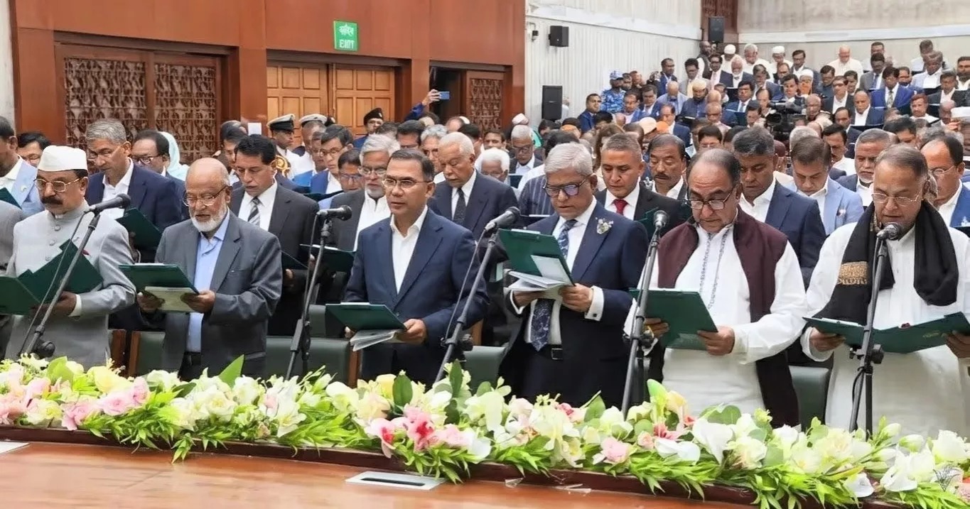 Newly elected members of parliament take their oath in the oath-taking hall of the National Parliament building on Tuesday morning, February 17. Photo taken from Bangladesh Television video.