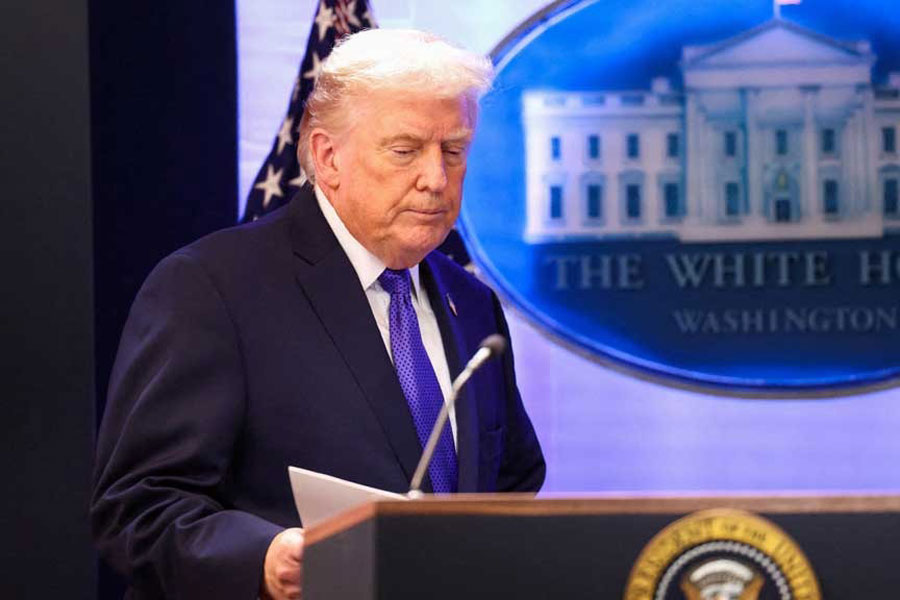 US President Donald Trump arrives for a press briefing at the White House, following the Supreme Court's ruling that Trump had exceeded his authority when he imposed tariffs, in Washington, DC, US, Feb 20, 2026.