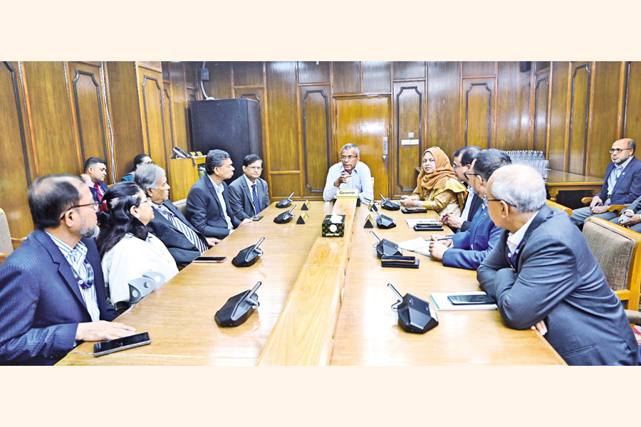 New Bangladesh Bank Governor Md Mostaqur Rahman, on his first day of joining, meets with deputy governors and executive directors in his conference room on Thursday. — Collected