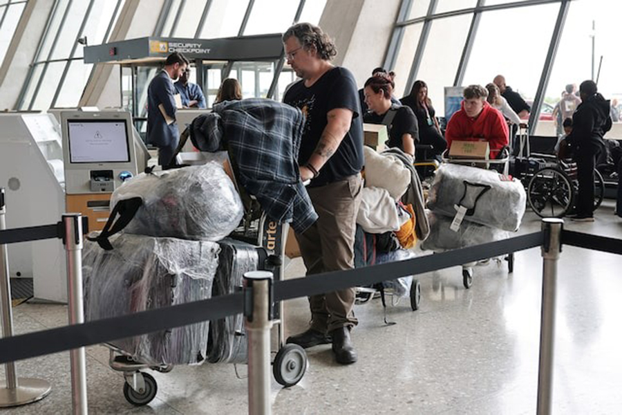 People from the first group of white South Africans granted refugee status for being deemed victims of racial discrimination under US President Trump's Refugee plan, check in for a connecting flight, at Dulles International Airport, in Dulles, Virginia, US on May 12, 2025 — Reuters/File