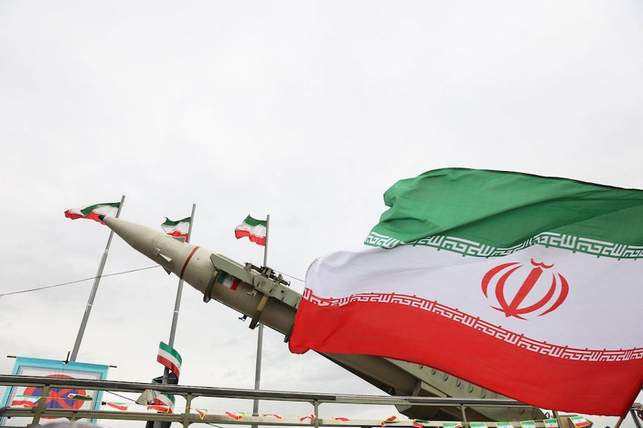 An Iranian flag flutters next to a missile on display during the 47th anniversary of the Islamic Revolution in Tehran, Iran February 11, 2026.
