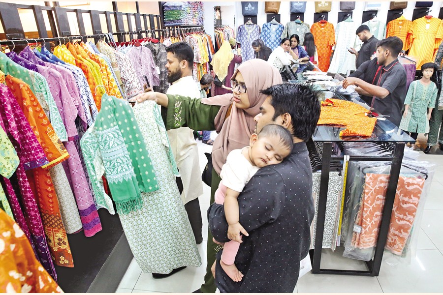 Shoppers are busy with Eid shopping at the Bashundhara City Shopping Mall in the capital on Friday — FE photo