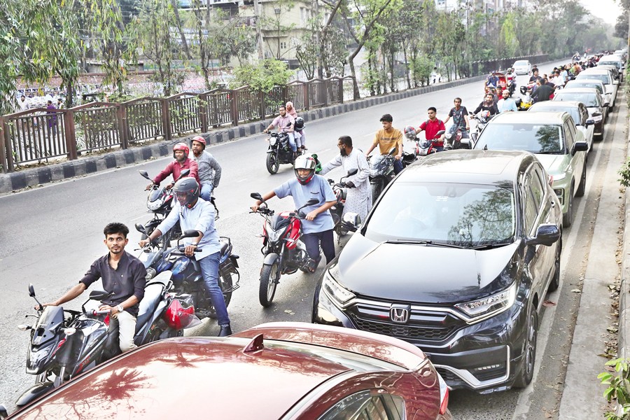 Panicked motorbike and car drivers form long queues at fuel stations amid shortage fears, as global supply drops due to Middle East tensions. The photo was taken at a fuel station in the Asad Gate area of the capital on Friday — FE Photo by Asad-Uz-Zaman
