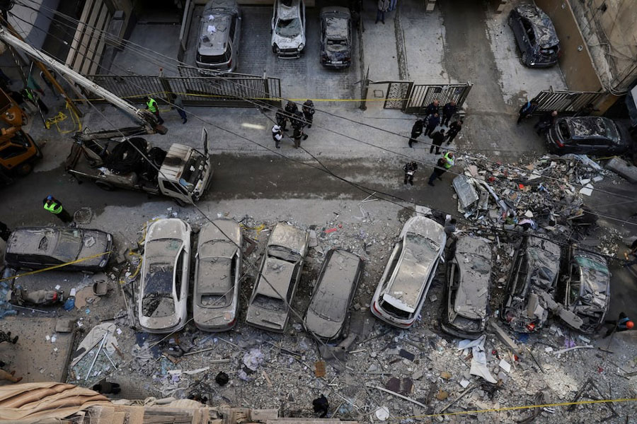 Debris and damaged vehicles at the site of an Israeli strike on an apartment building, in central Beirut, Lebanon.