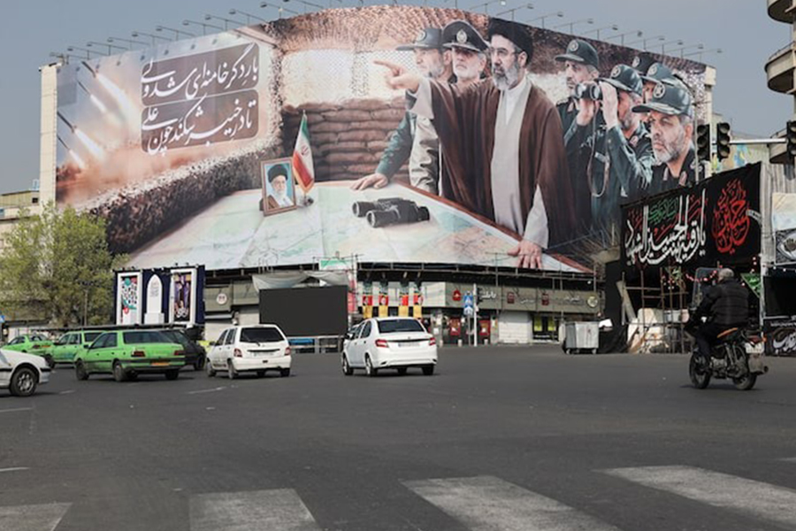 Cars pass a banner featuring Iran's new Supreme Leader Mojtaba Khamenei, amid the U.S.-Israeli conflict with Iran, in Tehran, Iran on March 14, 2026 — Retuers photo