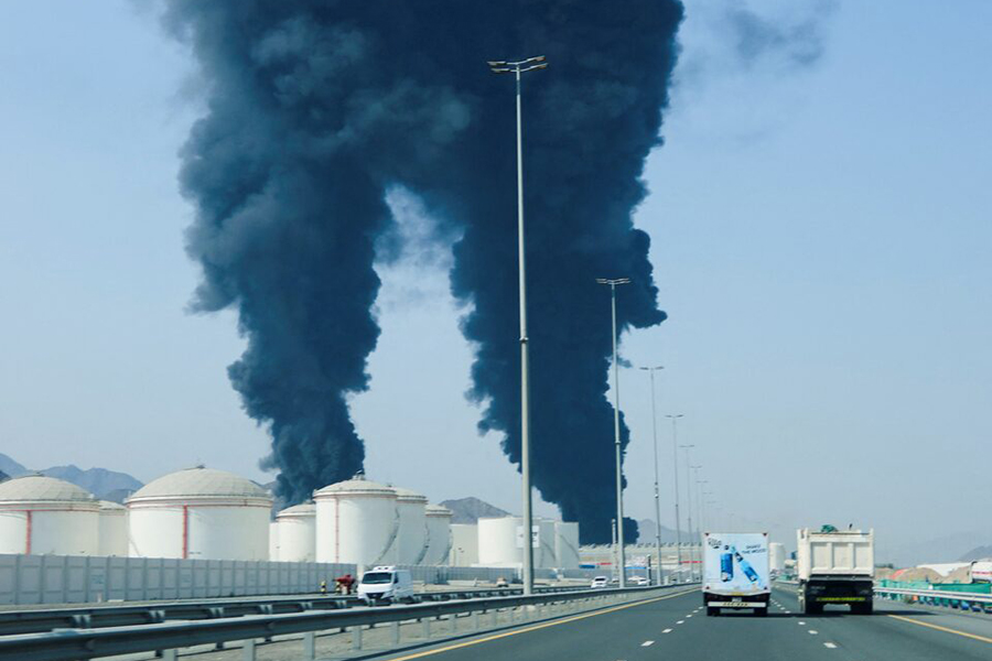 Smoke rises in the Fujairah oil industry zone, caused by debris after interception of a drone by air defenses, according to the Fujairah media office, amid the US-Israel conflict with Iran, in Fujairah, United Arab Emirates, on March 14, 2026 — Reuters photo