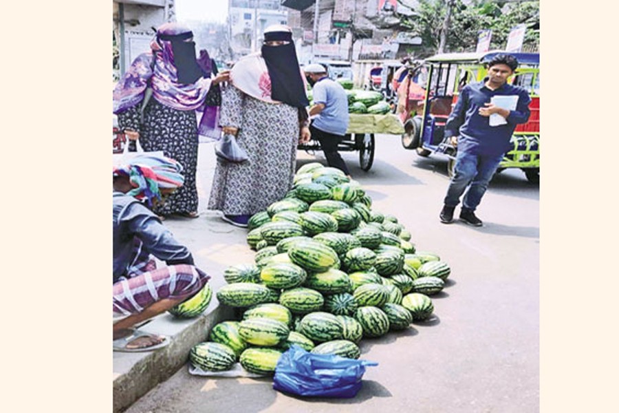 Water melons are being unloaded from trawlers at Chawdhury ghat in Chandpur town - FE Photo