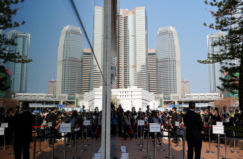 People arrive at the venue where an independent committee conducts evidential hearings for the deadly fire at Wang Fuk Court in Tai Po last November, in Hong Kong, China March 19, 2026. REUTERS/Joyce Zhou
