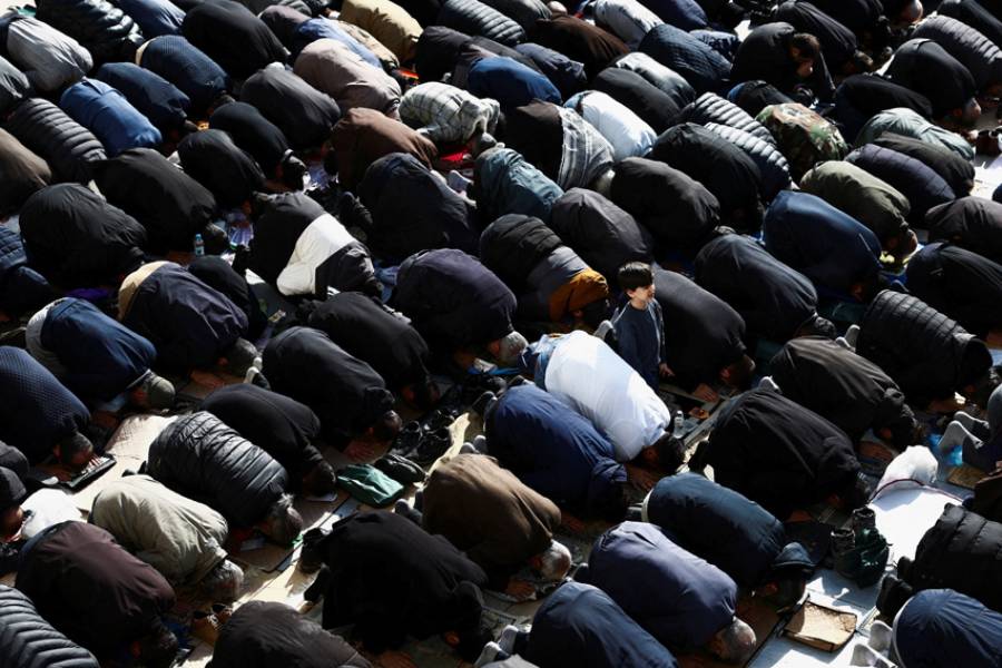 People attend Eid al-Fitr prayers, marking the end of Muslim holy fasting month of Ramadan, amid the US-Israeli conflict with Iran, in Tehran, Iran, March 21, 2026.