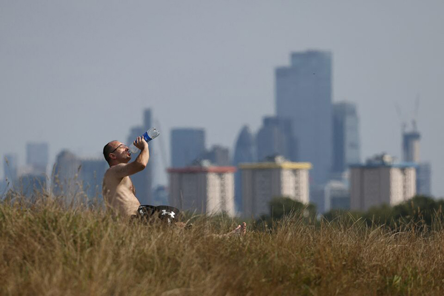 A man drinks from a bottle at Primrose Hill, in London, Britain, on September 3, 2023 — Reuters/File
