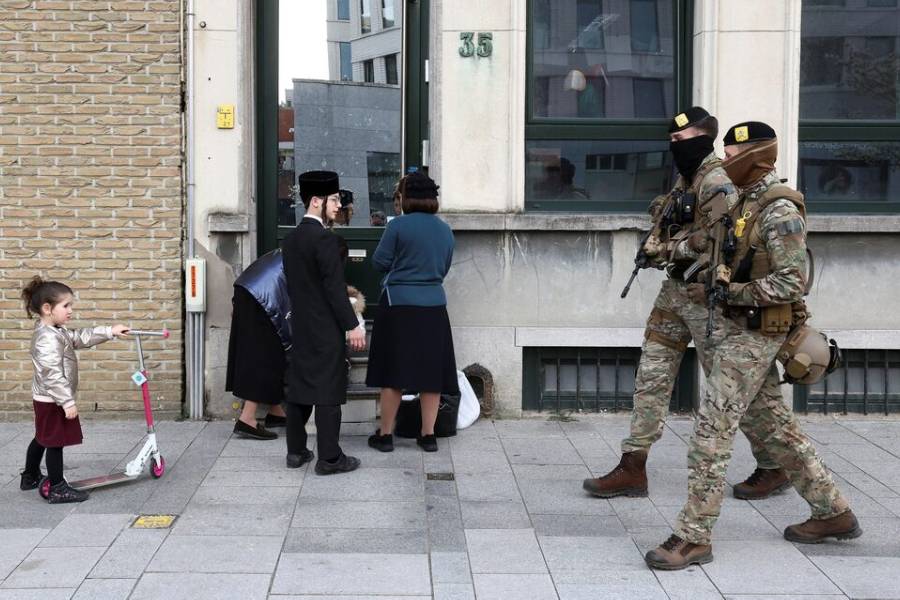 Belgian army personnel patroll a street as part of a deployment of soldiers outside Jewish institutions in Antwerp and Brussels following attacks at Jewish sites in Belgium and other European countries, in Antwerp, Belgium, March 23, 2026.