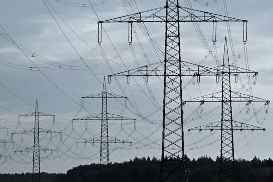 High-voltage power lines and electricity pylons are pictured close to the motorway A24 near Luettow-Valluhn, Germany January 31, 2025.