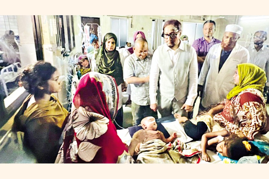 Chattogram City Corporation Mayor Shahadat Hossain visits measles patients at Chattogram Medical College Hospital on Monday. — Collected