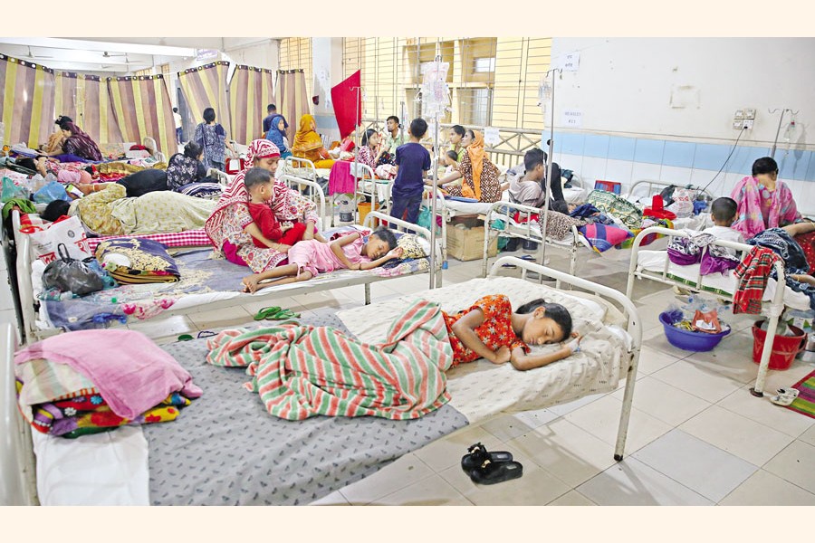 Children with measles symptoms receive treatment at a dedicated ward at Mugda Medical College Hospital in the capital on Wednesday as infections rise across the country. — FE Photo by K Asad-Uz-Zaman