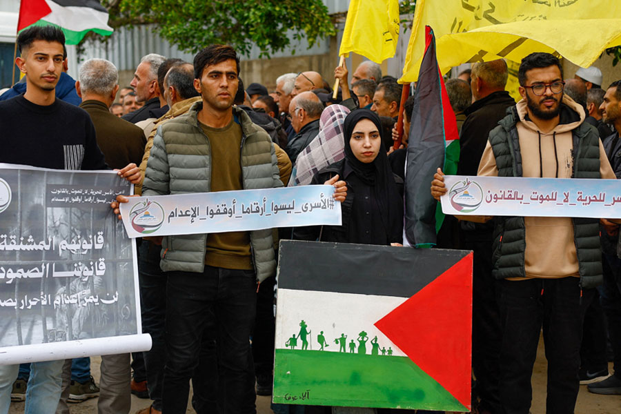 Palestinians take part in a protest against the execution of the Israeli death penalty law for Palestinians convicted in military courts of deadly attacks, at the headquarters of the International Committee of the Red Cross in Deir al-Balah in the central Gaza Strip, Apr 2, 2026.