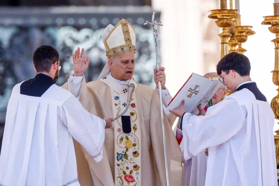 Pope Leo XIV blesses the faithful at the end of the Easter Mass in St. Peter's Square at the Vatican, April 5, 2026.