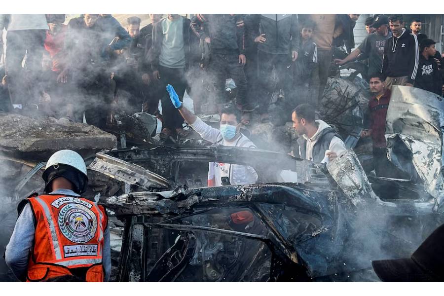Emergency services work at the site of what medics said was an Israeli airstrike on a car near the entrance to Zawayda town, amid the U.S.-Israeli conflict with Iran, in the central Gaza Strip, April 4, 2026. Picture taken with a mobile phone.
