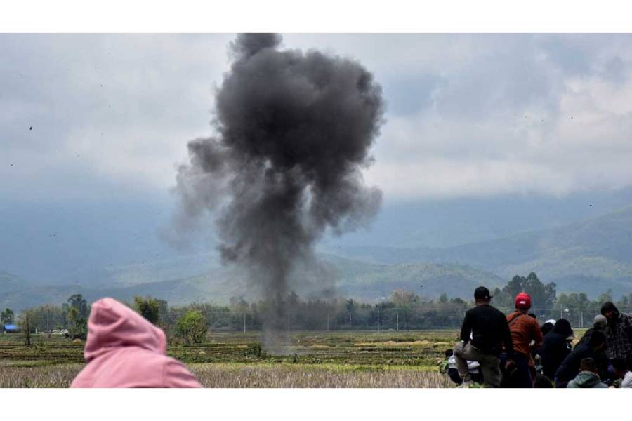 Smoke rises after a munition was detonated by a bomb squad in Bishnupur district, Manipur, India, Apr 7, 2026.