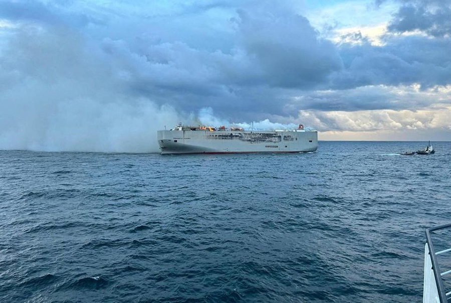 Smoke rises as a fire broke out on the cargo ship Fremantle Highway, at sea on July 26, 2023 — Coastguard Netherlands/Handout via REUTERS