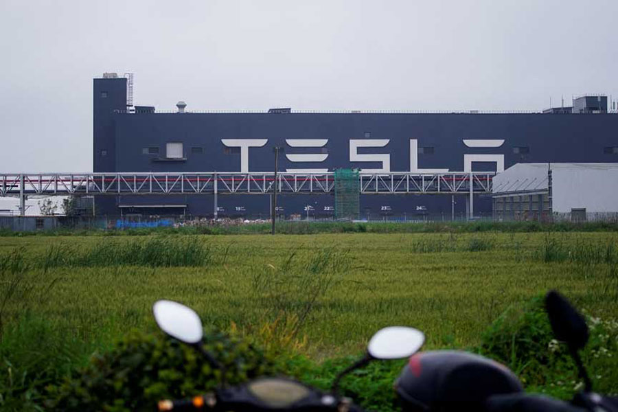 A Tesla sign is seen at its factory in Shanghai, China, May 13, 2021.