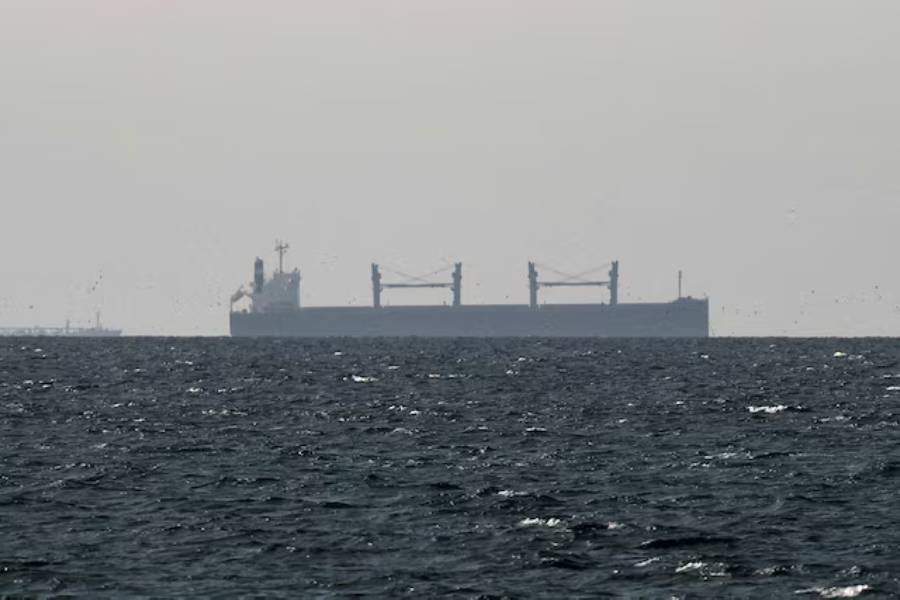 A cargo ship in the Gulf, near the Strait of Hormuz, as seen from northern Ras al-Khaimah, near the border with Oman’s Musandam governance, amid the U.S.-Israeli conflict with Iran, in United Arab Emirates, March 11, 2026.