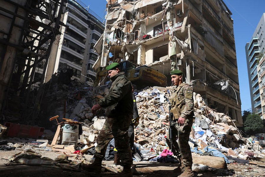 Members of the military at the site of an Israeli strike carried out on Wednesday, in Ain Al Mraiseh in Beirut, Lebanon, April 9, 2026.