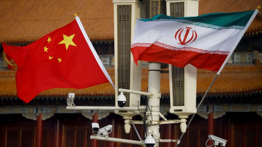 The national flags of China and Iran fly in Beijing's Tiananmen Square on February 14, 2023. Thomas Peter/Reuters/File