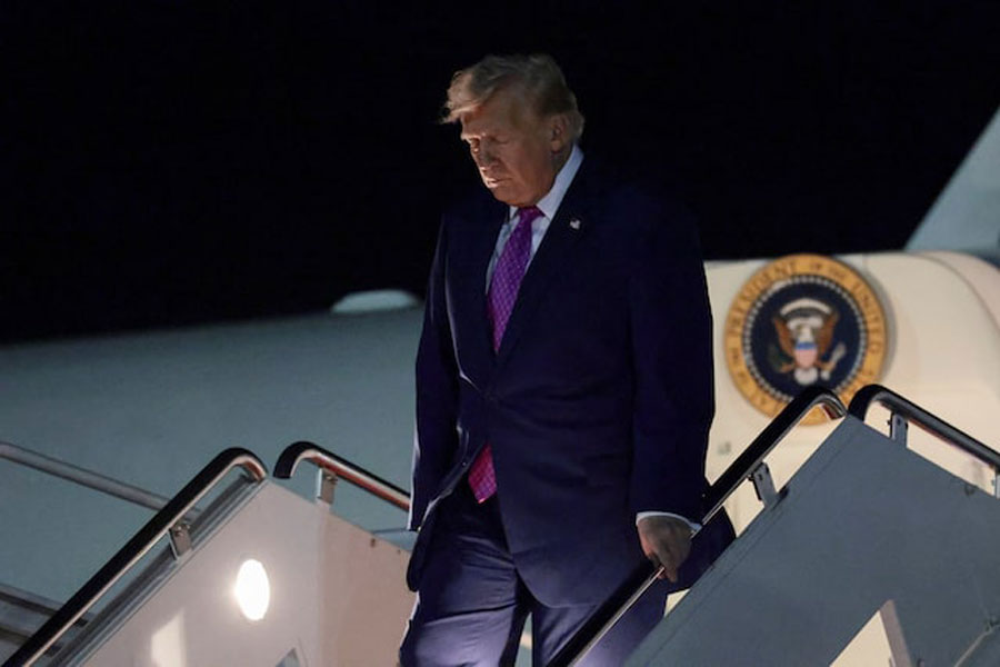 US President Donald Trump exits Air Force One after returning from Virginia, at Joint Base Andrews in Maryland, US, April 10, 2026.