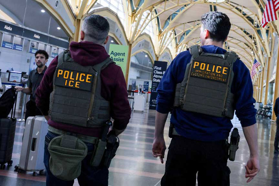 US Immigration and Customs Enforcement (ICE) agents patrol at Washington Reagan National Airport in Arlington, Virginia, US, Mar 24, 2026.
