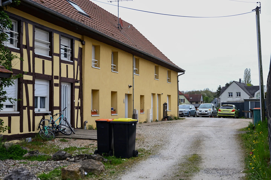 Outside view of the building and the parking area where a 9-year-old boy was rescued after living locked in his father's utility van since 2024, in Hagenbach, Eastern France, Saturday, on April 11, 2026 — AP photo
