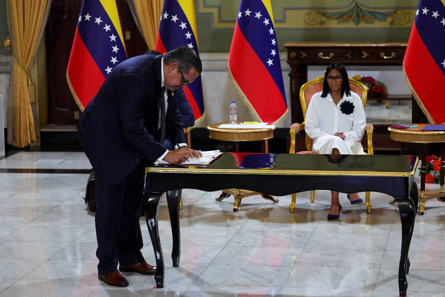 Venezuela's interim President Delcy Rodriguez looks on as Mariano Vela, President of Chevron in Venezuela signs an oil agreement between Chevron and Venezuela's state oil company PDVSA, in Caracas, Venezuela on April 13, 2026 — Reuters photo