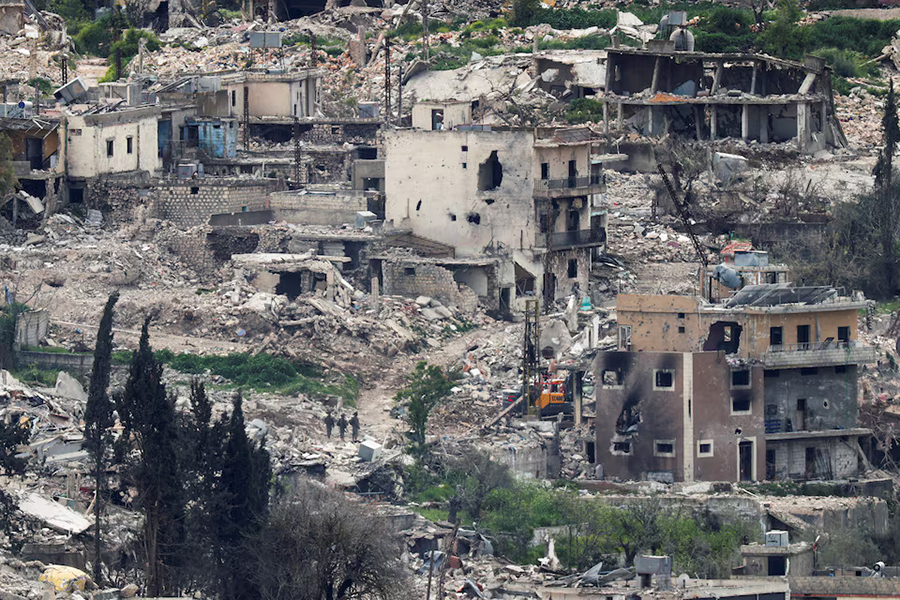 Israeli soldiers stand among destroyed buildings in southern Lebanon, near the Israel-Lebanon border, as seen from the Israeli side of the border in northern Israel, on April 14, 2026 — Reuters photo