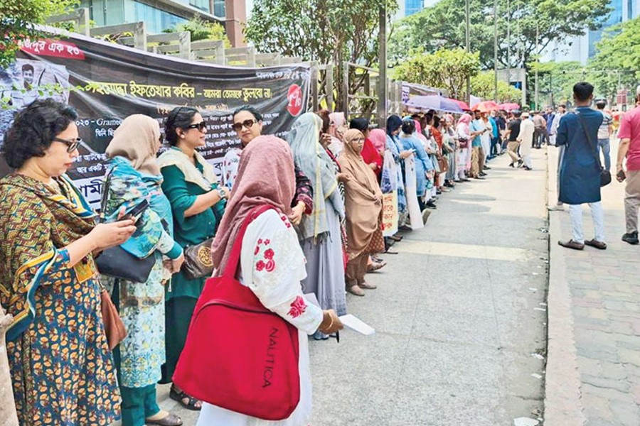 Former employees of Grameenphone stage a demonstration in front of its headquarters in the capital on Wednesday, demanding payment of their long-pending dues. FE Photo