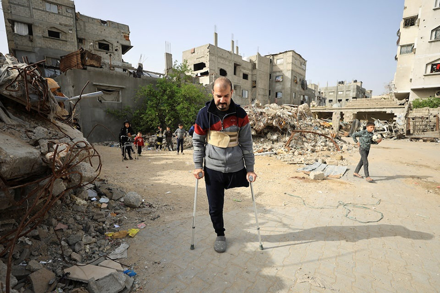 Palestinian amputee Hazem Foura, who lost one leg, walks using crutches in a street in Gaza City, on April 3, 2026 — Reuters/File