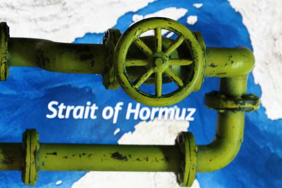 A map showing the Strait of Hormuz and a 3D printed oil pipeline are seen in this illustration taken Mar 23, 2026.